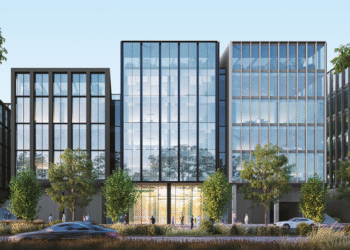 Glass-fronted office buildings at Arada Central Business District in Aljada, Sharjah, featuring modern design and smart infrastructure certified WiredScore Platinum.