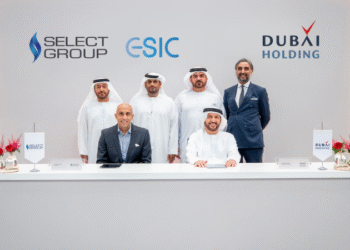 Khalid Al Malik and Rahail Aslam seated together during the signing of the strategic partnership between Dubai Holding and Select Group.