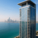 Modern high-rise building in Abu Dhabi overlooking the Arabian Gulf, representing Mered’s waterfront development on Al Reem Island