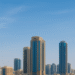 Aerial view of modern buildings and waterfront in Ajman, highlighting the emirate’s growing real estate market.