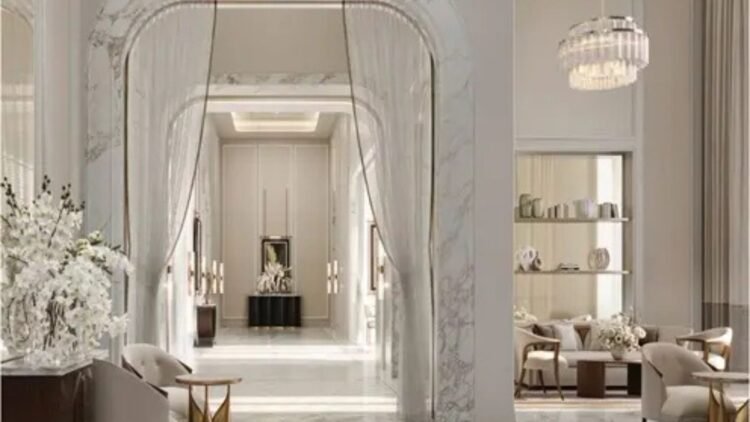 Elegant interior of Corinthia Dubai Residences featuring marble arches, soft lighting, modern furniture, and a serene luxury ambiance.