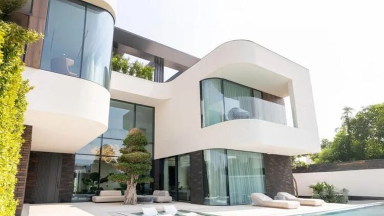 Exterior view of Kaia Villa Pearl Jumeirah Dubai showing modern architecture, pool deck, and rooftop terrace.