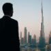 Business investor overlooking Dubai’s luxury skyline, symbolizing property investment opportunities.