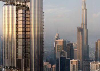 A high-resolution image of a futuristic glass skyscraper representing LUMENA ALTA by OMNIYAT, Dubai’s tallest luxury commercial tower in Business Bay.