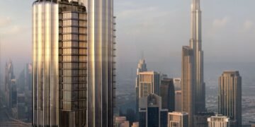 A high-resolution image of a futuristic glass skyscraper representing LUMENA ALTA by OMNIYAT, Dubai’s tallest luxury commercial tower in Business Bay.