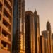 Vacant Dubai investment apartments with for rent signs on high‑rise towers