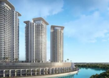 Aerial view of Radisson Residences Al Reem Island waterfront towers amid Abu Dhabi mangroves.