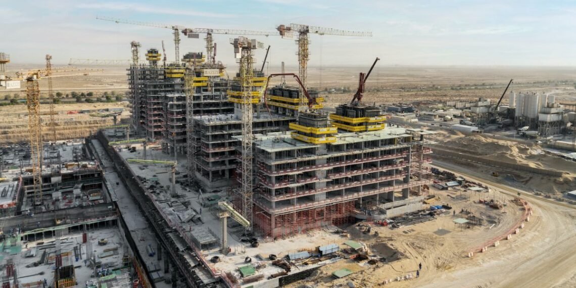 Azizi Venice construction progress Dubai showing multiple mid-rise towers under construction in Dubai South