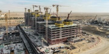 Azizi Venice construction progress Dubai showing multiple mid-rise towers under construction in Dubai South