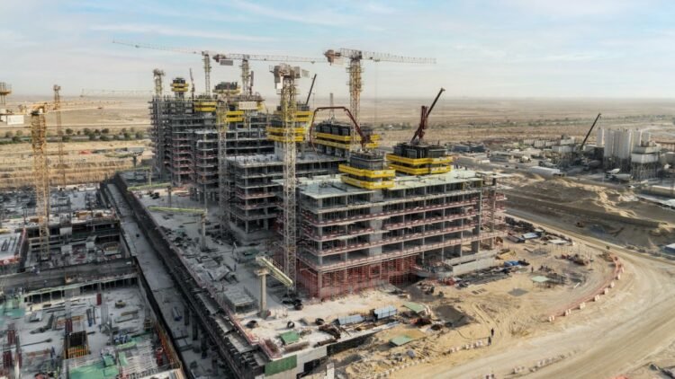 Azizi Venice construction progress Dubai showing multiple mid-rise towers under construction in Dubai South