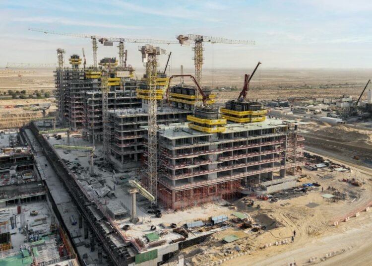 Azizi Venice construction progress Dubai showing multiple mid-rise towers under construction in Dubai South