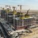 Azizi Venice construction progress Dubai showing multiple mid-rise towers under construction in Dubai South