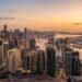 Aerial view of Dubai residential skyline at dusk with high-rise towers in Business Bay, reflecting Dubai real estate sales 2026 transaction volumes against a clear sky.