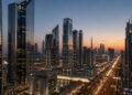 Grade A office towers along Sheikh Zayed Road illustrating the Dubai office space shortage in Business Bay and DIFC at dusk
