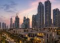Dubai residential towers and villa community at dusk, showing the Dubai off-plan property prices correction in 2026