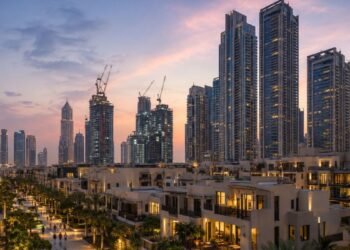 Dubai residential towers and villa community at dusk, showing the Dubai off-plan property prices correction in 2026