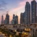 Dubai residential towers and villa community at dusk, showing the Dubai off-plan property prices correction in 2026