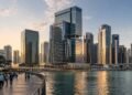 Grade A office towers along the Business Bay canal at dusk, the district driving Dubai off-plan office sales in the first half of 2026