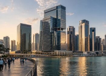 Grade A office towers along the Business Bay canal at dusk, the district driving Dubai off-plan office sales in the first half of 2026
