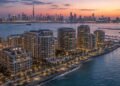 Waterfront branded apartment towers at Dubai Maritime City, the coastal district behind Dubai football-branded residences such as DAMAC's Chelsea project