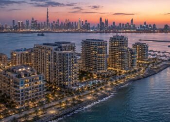 Waterfront branded apartment towers at Dubai Maritime City, the coastal district behind Dubai football-branded residences such as DAMAC's Chelsea project