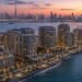 Waterfront branded apartment towers at Dubai Maritime City, the coastal district behind Dubai football-branded residences such as DAMAC's Chelsea project