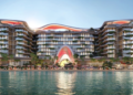 Topped-out concrete frame of The Unexpected Al Marjan Island Hotel & Residences in Ras Al Khaimah with façade work under way.
