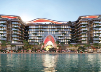 Topped-out concrete frame of The Unexpected Al Marjan Island Hotel & Residences in Ras Al Khaimah with façade work under way.